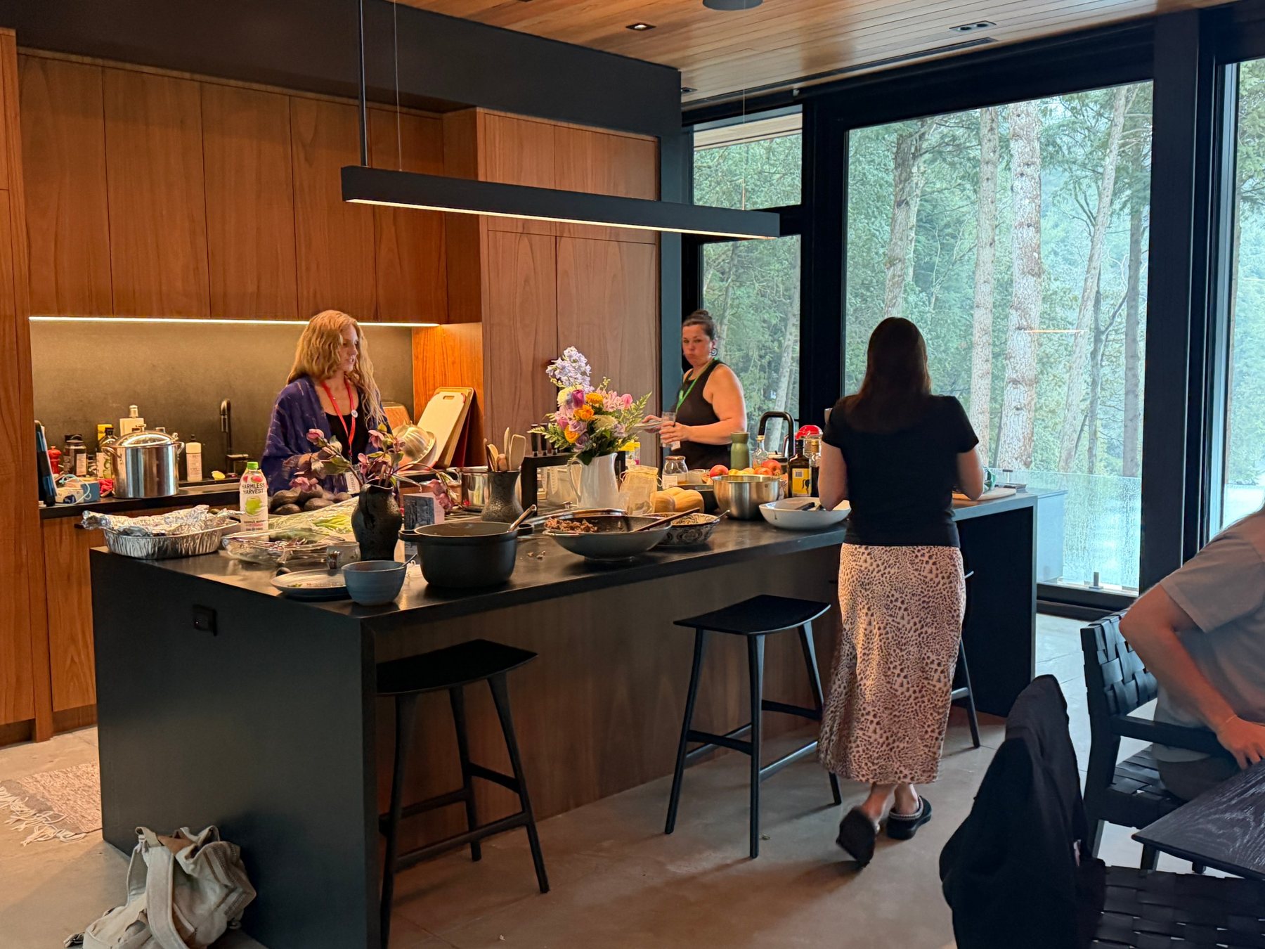 The team preparing a meal together in the retreat kitchen